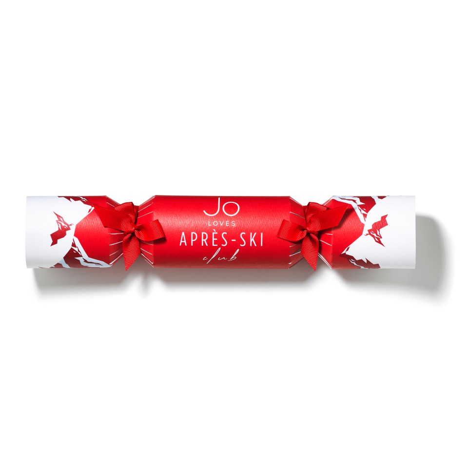 a red and white christmas cracker that says jo loves apres-ski