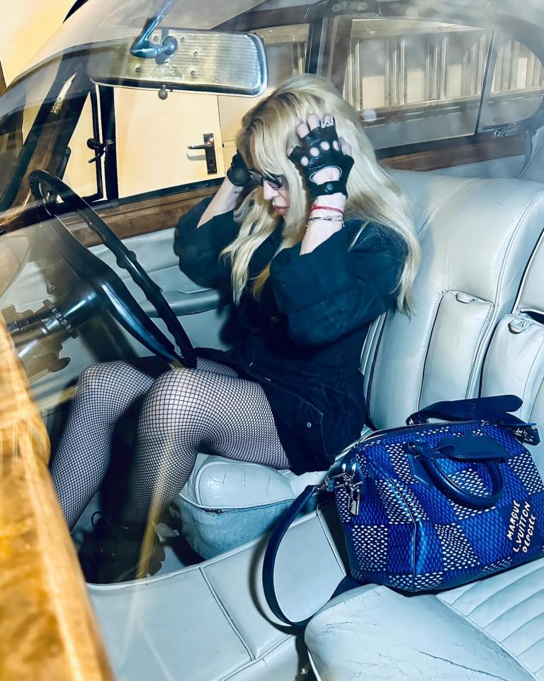 Madonna inside the vehicle