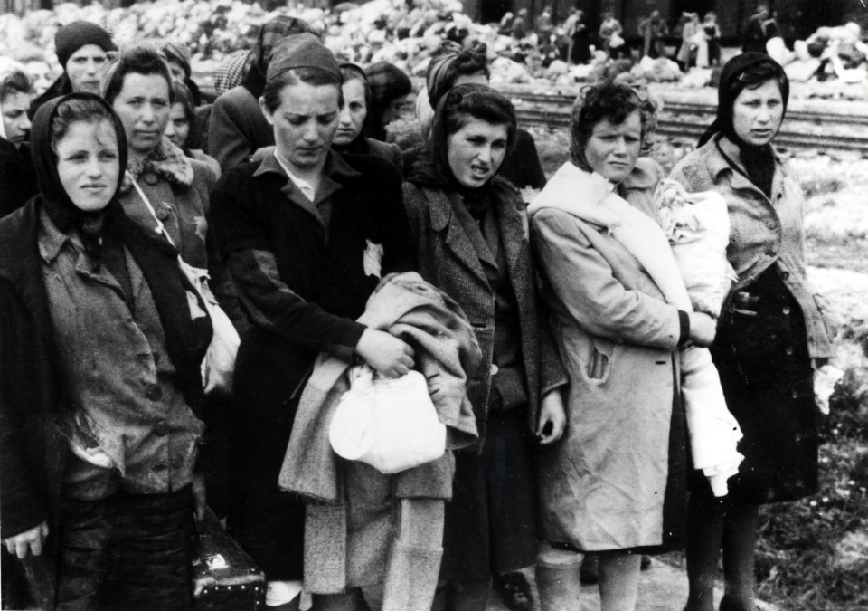 a black and white photo of a group of women