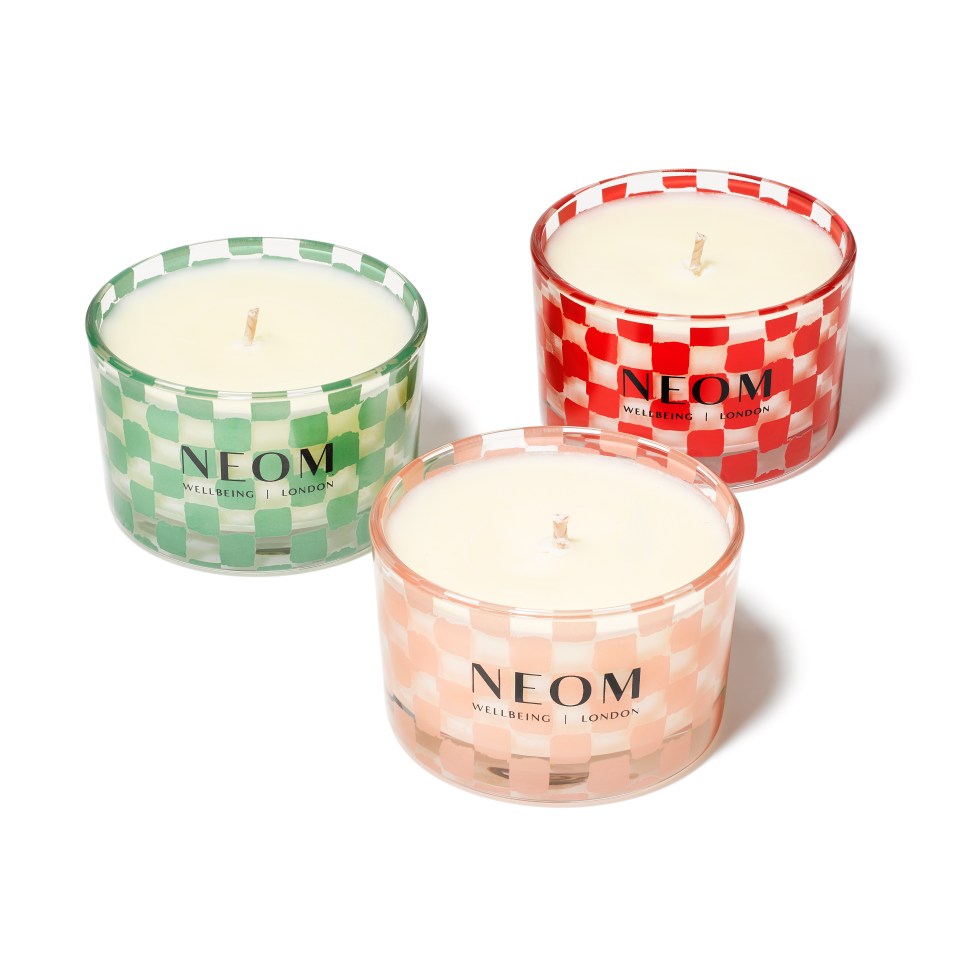 three candles made by neom wellness london