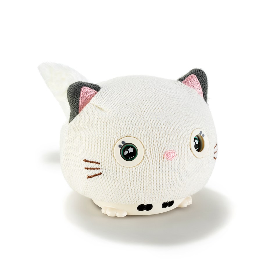 a stuffed animal in the shape of a cat