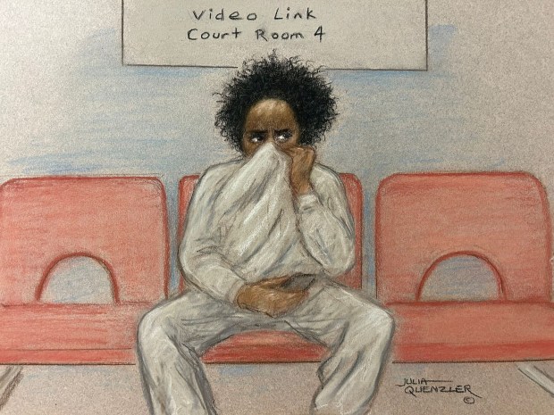 a drawing of a man covering his face in front of a sign that says video link court room 4