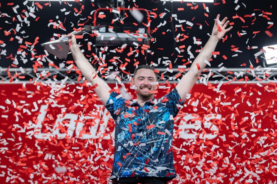 Mandatory Credit: Photo by Ian Stephen/ProSports/REX/Shutterstock (14938687eq) Luke Humphries (ENG) lifts the trophy, winner of the 2024 Ladbrokes Players Championship at Butlins Minehead, Minehead Players Championships, 2024 Darts Championship - 24 Nov 2024