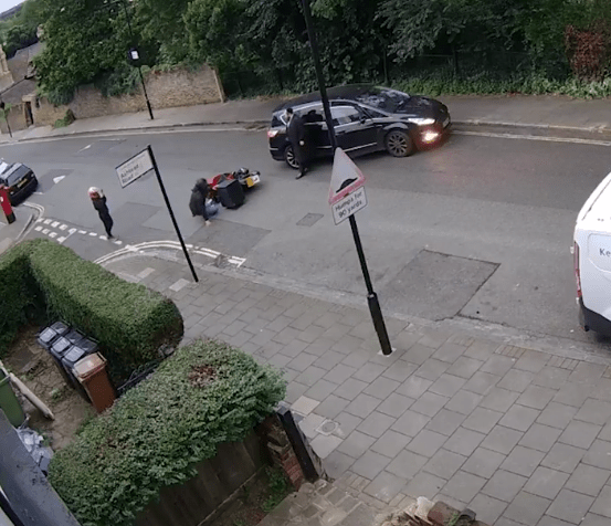 A passer-by took their phone out to take photos of the faked crash