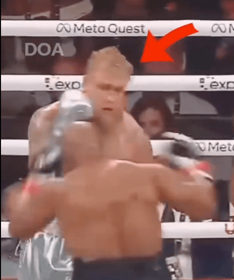 a man in a boxing ring with an arrow pointing to meta quest