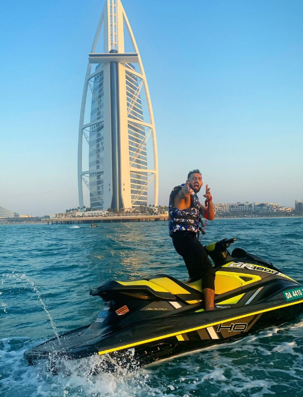 Slim posing on a jet ski posted on Instagram @slimthehitman.