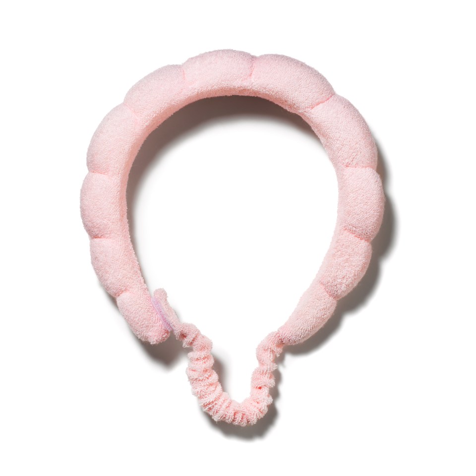 a pink headband on a white background that looks like a balloon