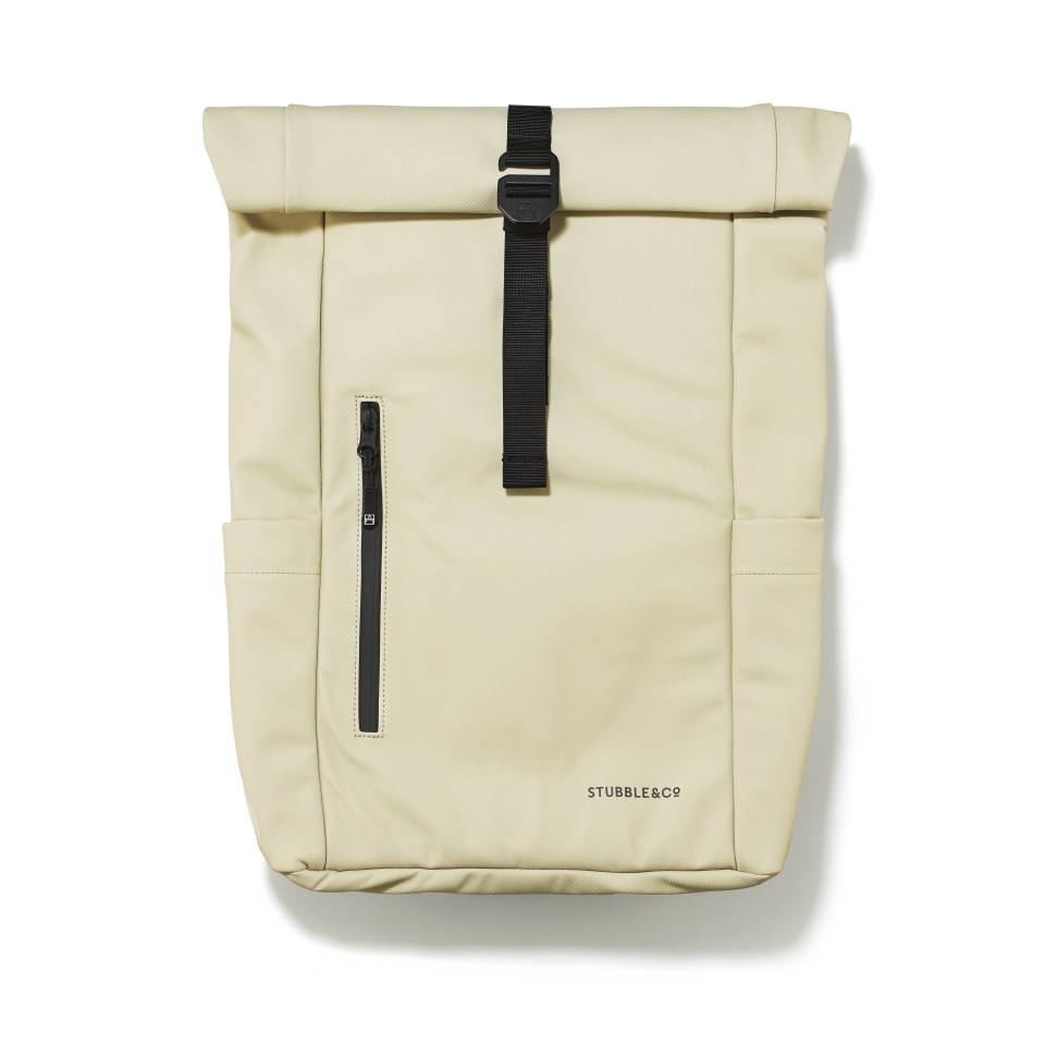 a white stubble & co backpack with a black strap