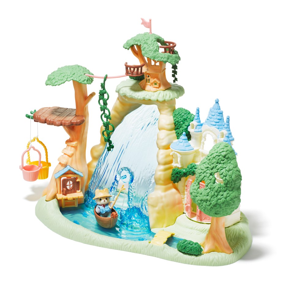 a toy scene with a waterfall and a castle