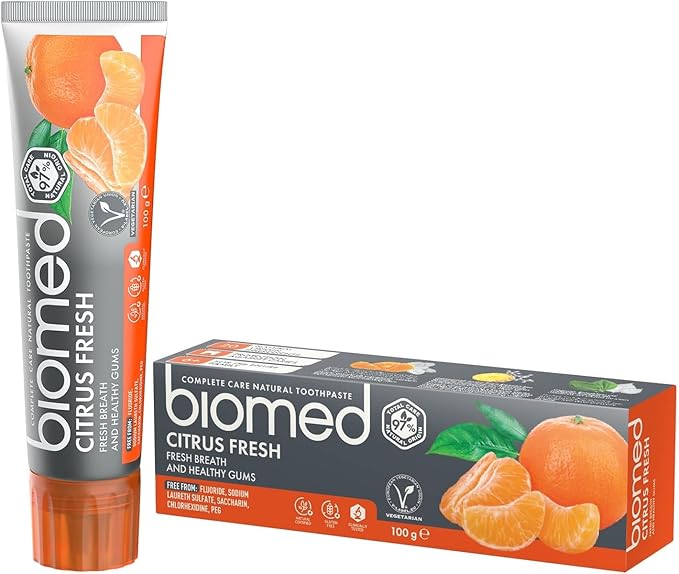 a tube of biomed citrus fresh toothpaste next to its box