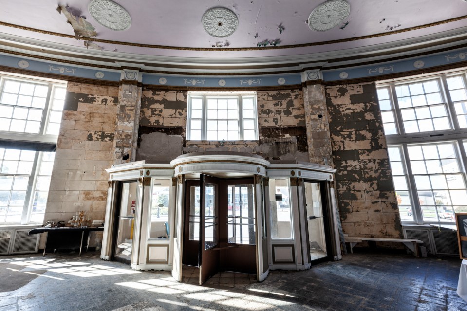 a very old building with the letter m on the ceiling