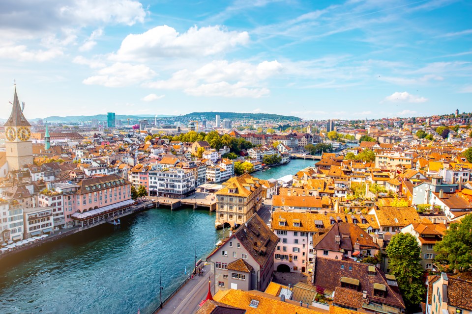 an aerial view of a city with a river running through it