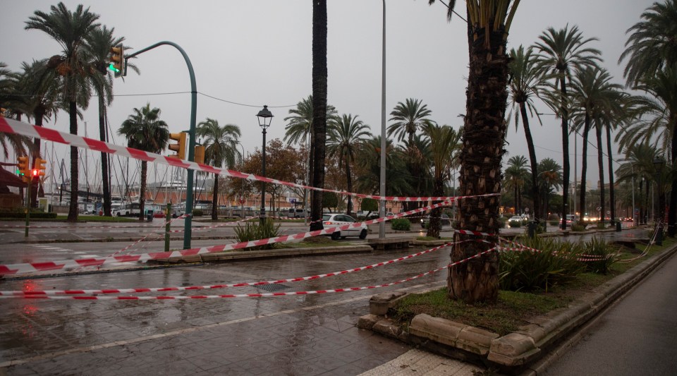 a street with a red and white tape around it