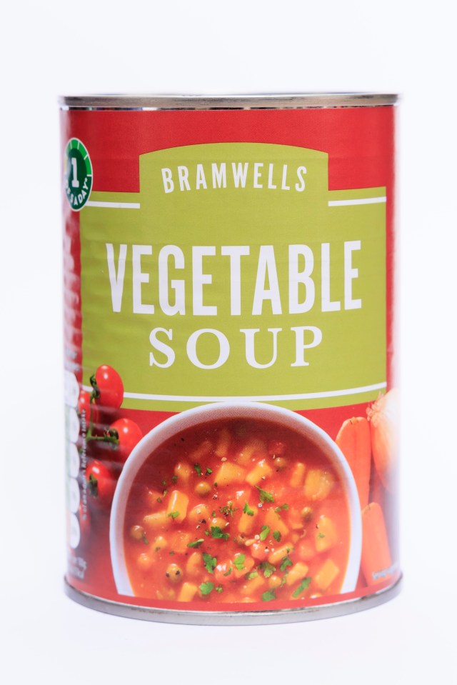 a can of bramwells vegetable soup with a bowl of soup