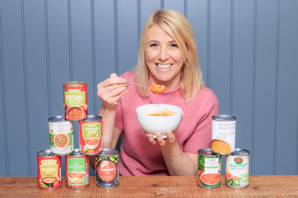 a woman is eating a bowl of vegetable soup