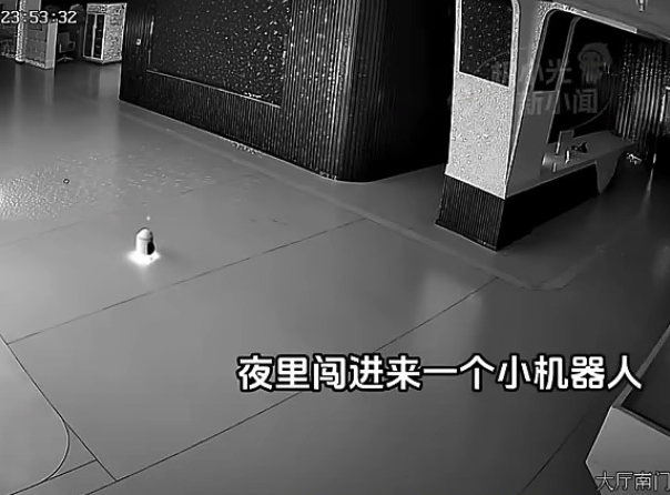 The tiny bot is seen entering the showroom