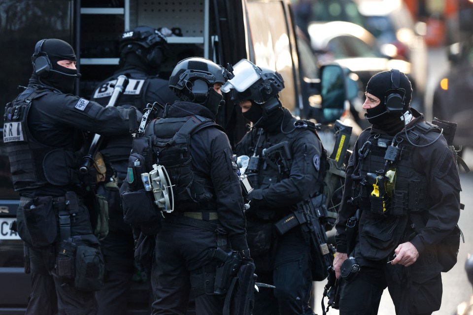 French National Police Search and Intervention Brigade officers (BRI) near the Pizza restaurant