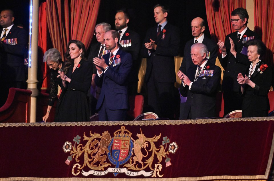 The royals are all seen side by side with their emblem on the royal box