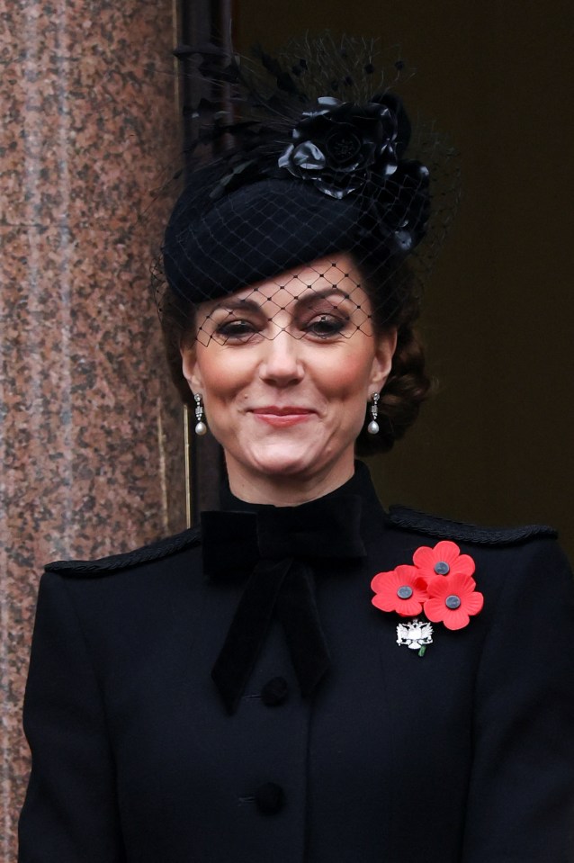 a woman wearing a black hat holds a piece of paper