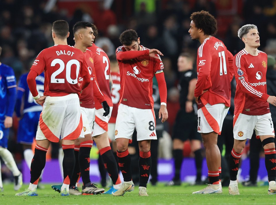 a group of soccer players with one wearing the number 20