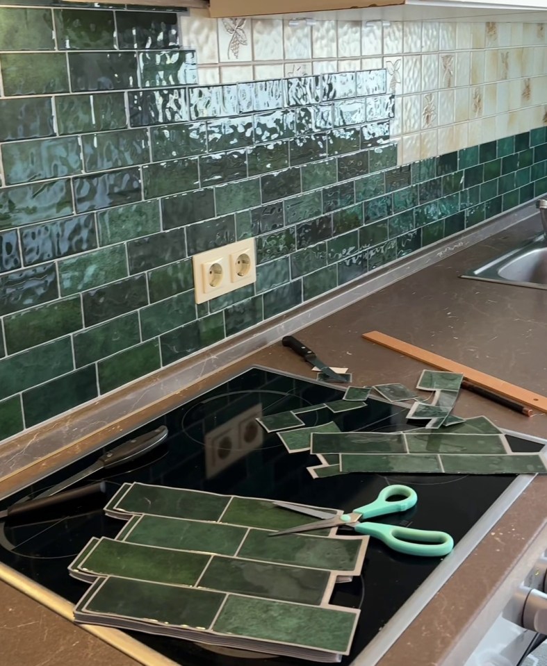 Riri covered the old backsplash in her kitchen with green stick and peel tiles from Shein