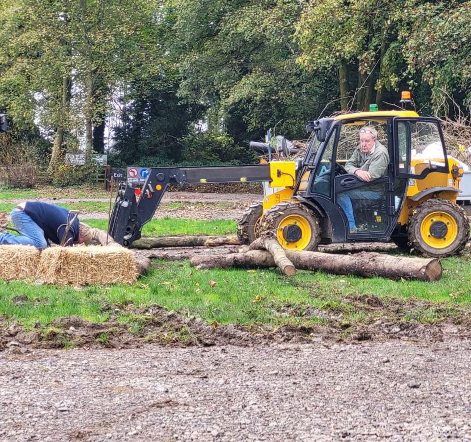 Jeremy Clarkson watches as Kaleb digs bonfire hole