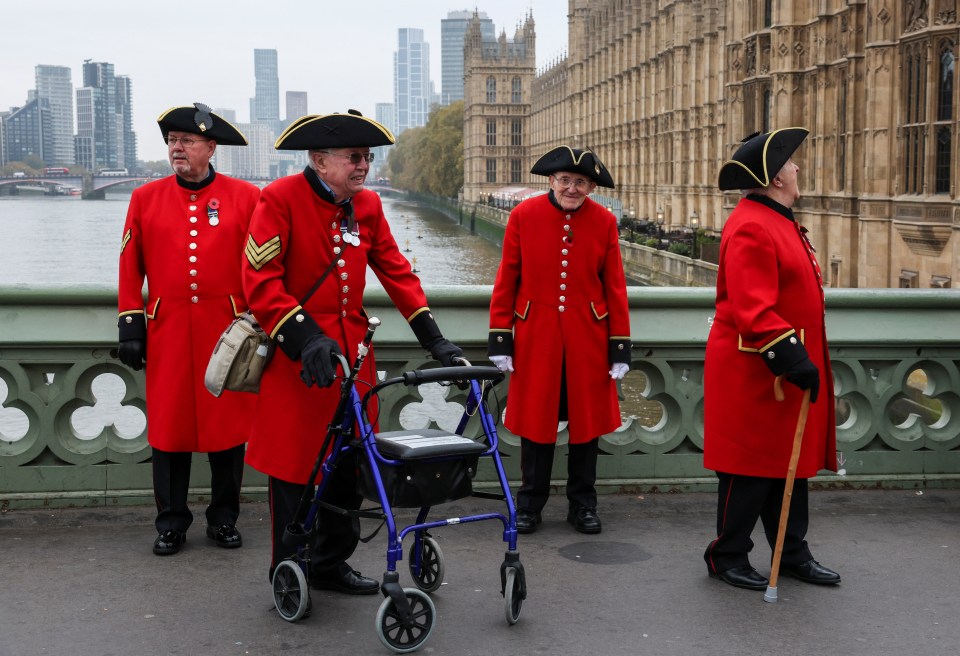 Chelsea Pensioners stand on Westminster Bridge