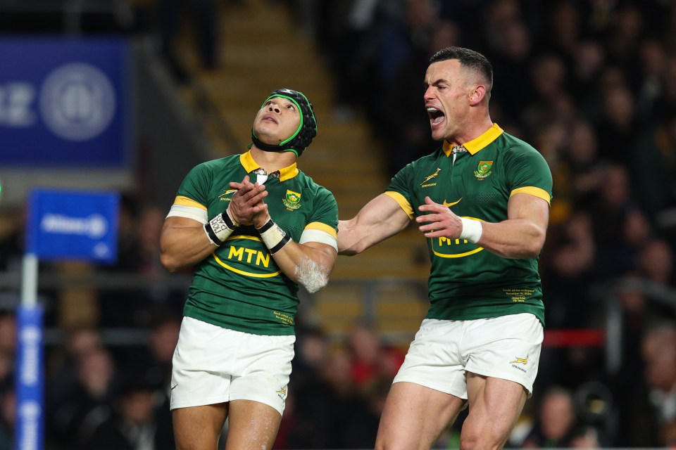 two rugby players wearing mtn jerseys are celebrating