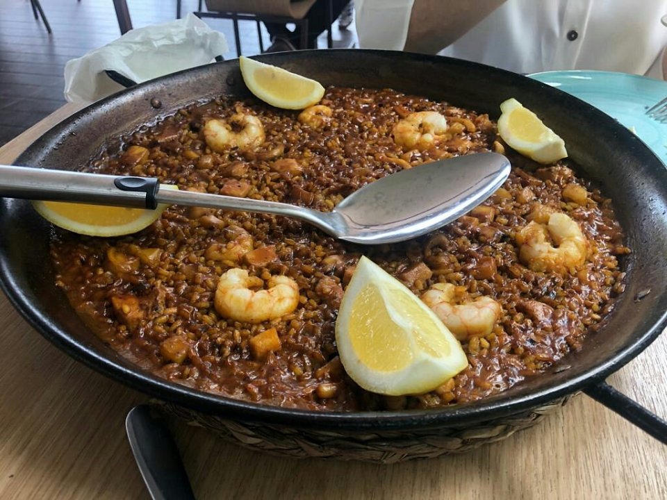 Savor the local paella speciality