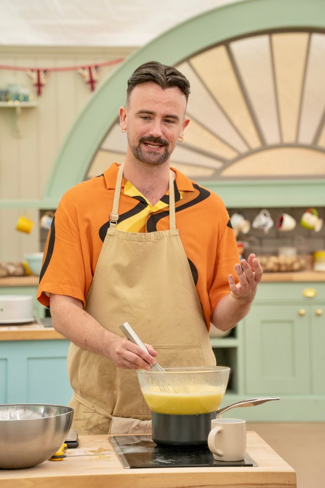 a man in an apron is mixing something in a bowl