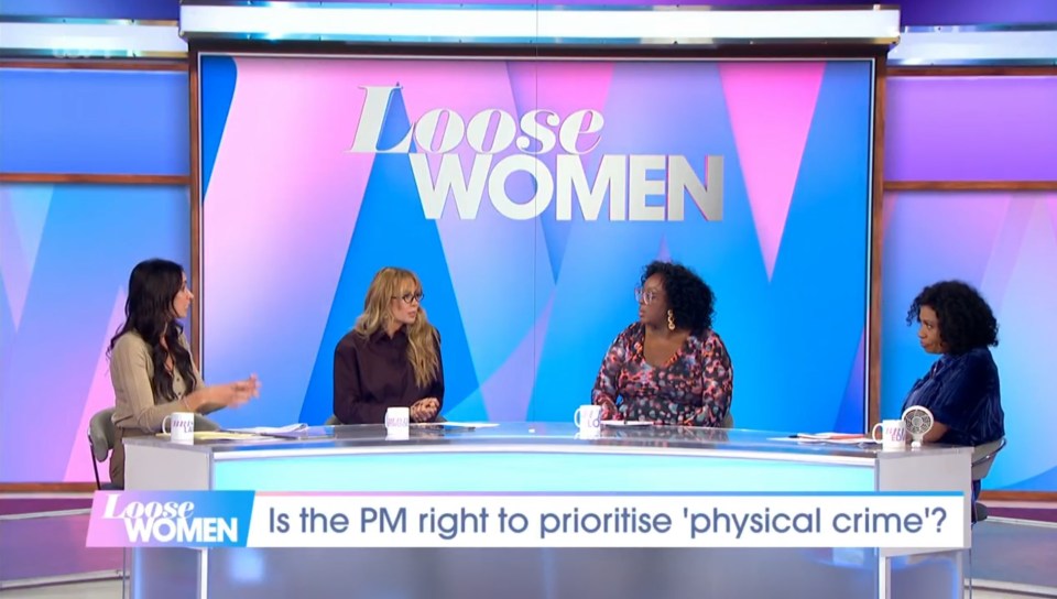 four women are sitting at a table on loose women