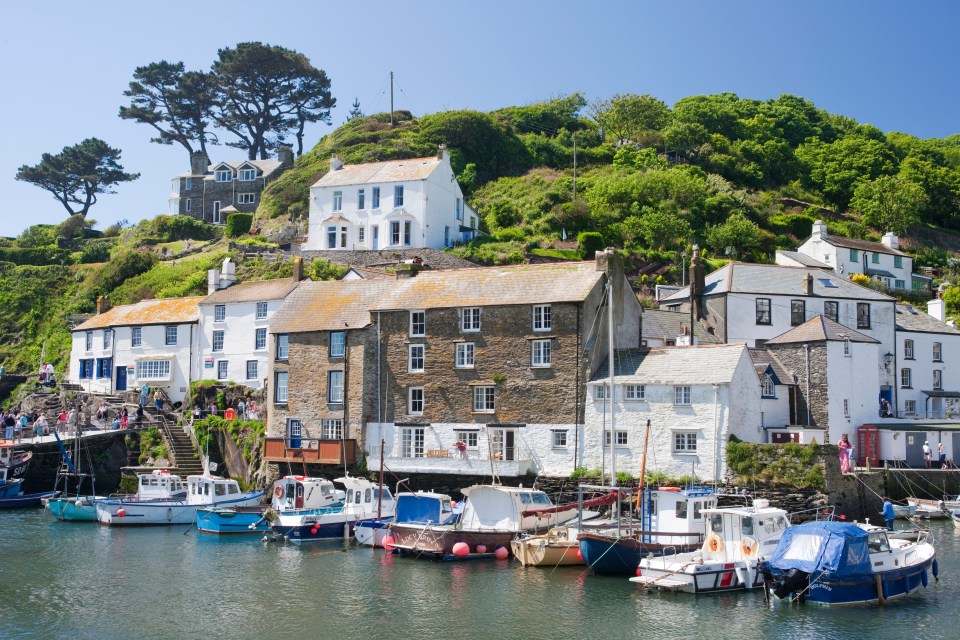 Rugged cliffs tumble into gold sand beaches with turquoise seas and fishing villages like Polperro (pictured)