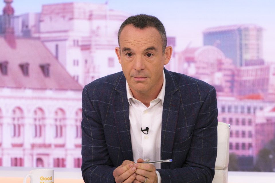 a man sits in front of a good morning britain mug