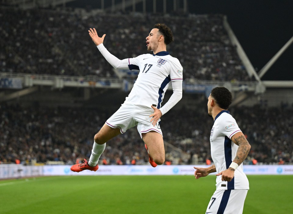 a soccer player wearing number 17 jumps in the air