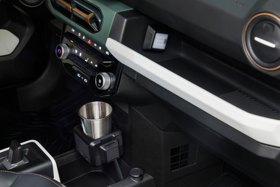 a cup holder in the center console of a car