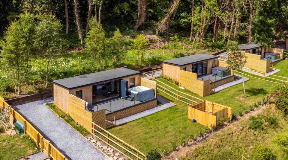 John Phillips, 39, built the £200-a-night seaside chalets on his own land at a beauty spot