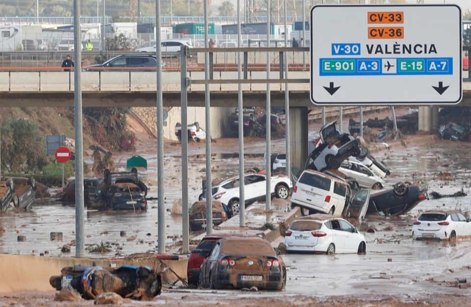 Cars now litter roads after being caught in the torrents