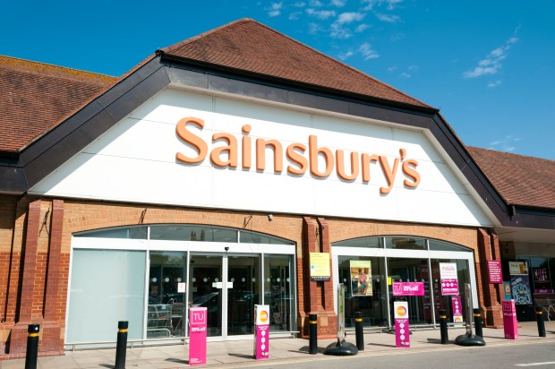 a sainsbury 's store with a blue sky in the background