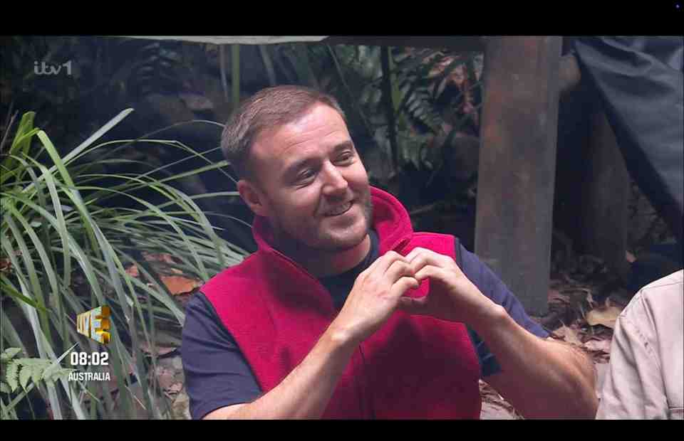 Alan Halsall makes a sweet heart sign with his hands whenever Ant and Dec reveal who is doing the trial