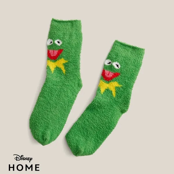 a pair of green kermit the frog socks from disney home