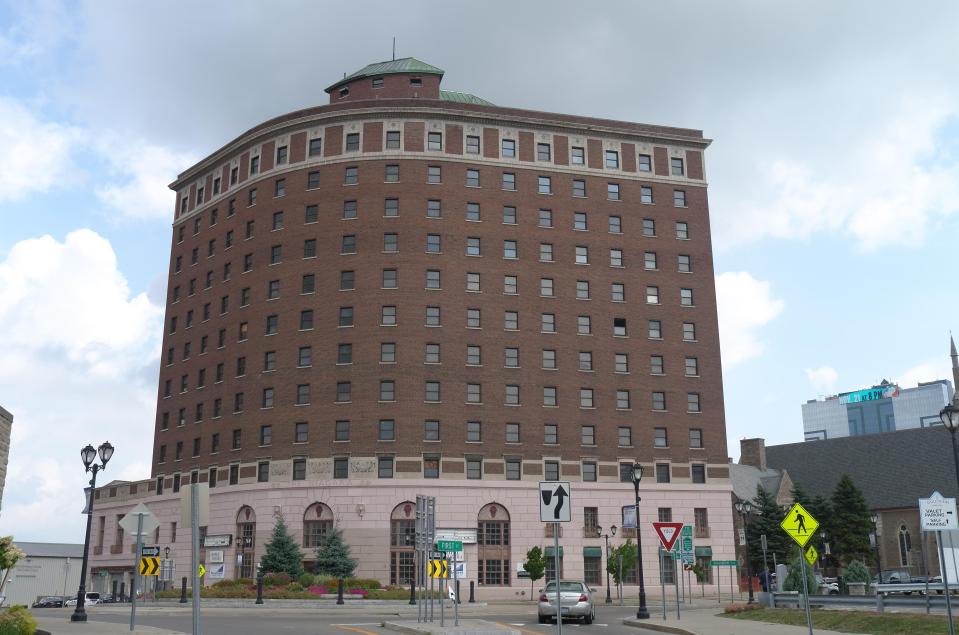 a large brick building with a sign that says ' downtown ' on it