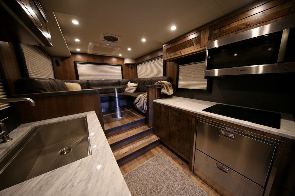 The spacious interiors features a full kitchen, dining area and bedroom