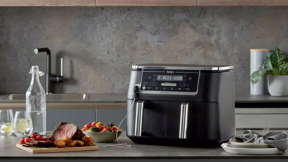 a ninja air fryer is sitting on a kitchen counter