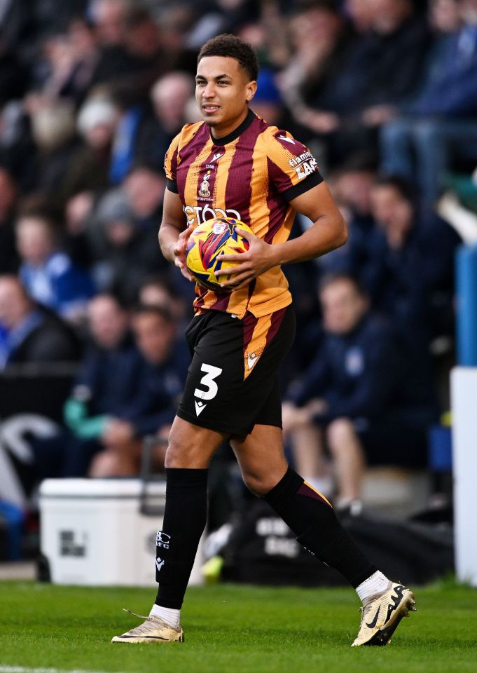 a soccer player with the number 3 on his shorts