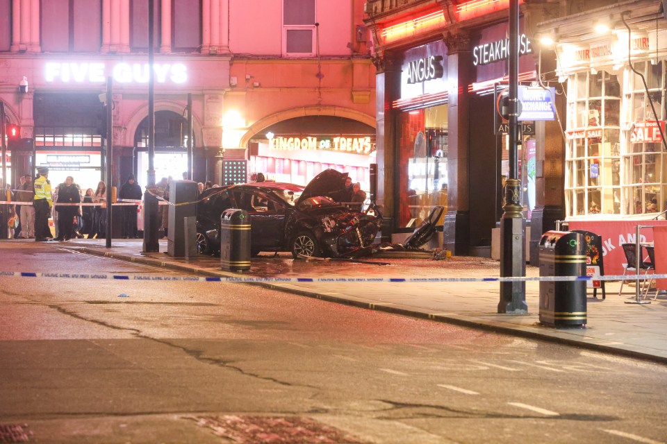 The mangled remains of the car lay just outside an Angus Steakhouse restaurant