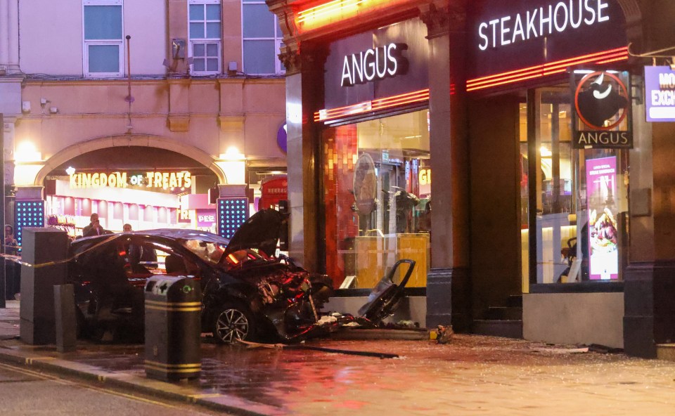 The mangled car on a pavement outside the Angus Steakhouse in Haymarket