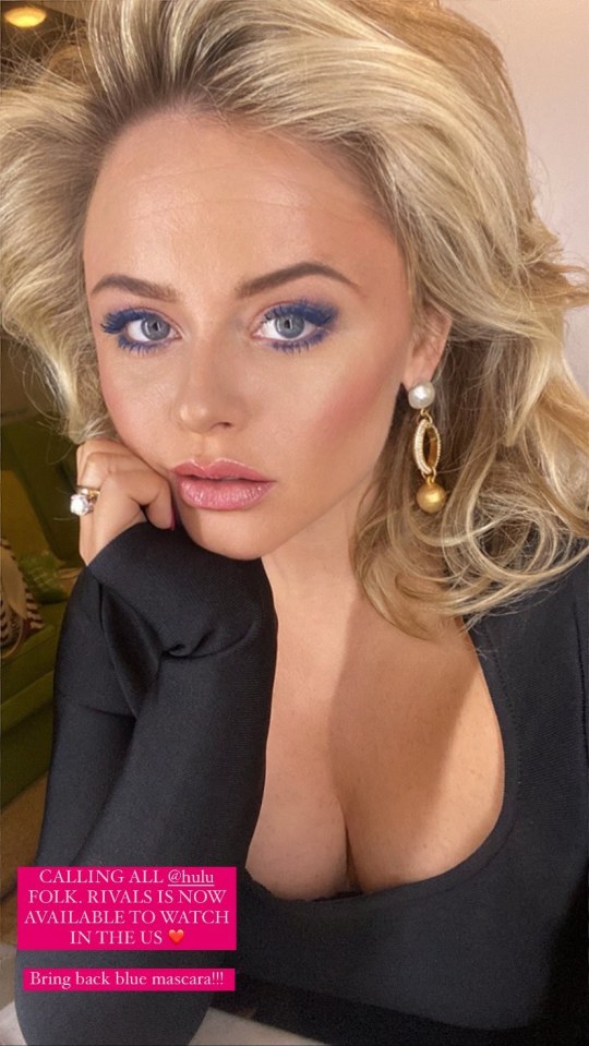 Emily Atack donned a plunging black top as she posed a super-glam selfie