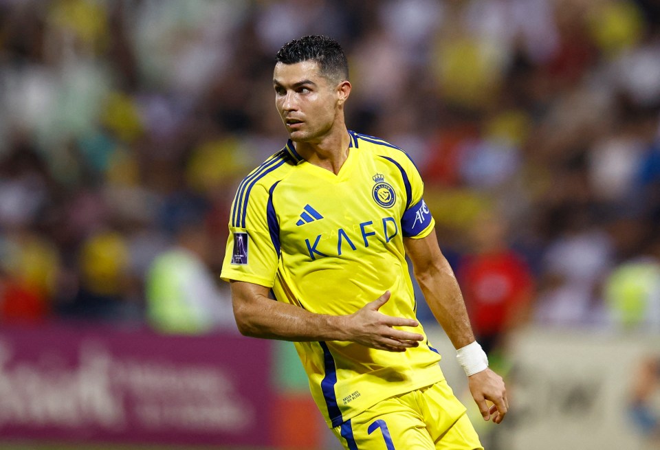 a soccer player wearing a yellow and blue kafr jersey