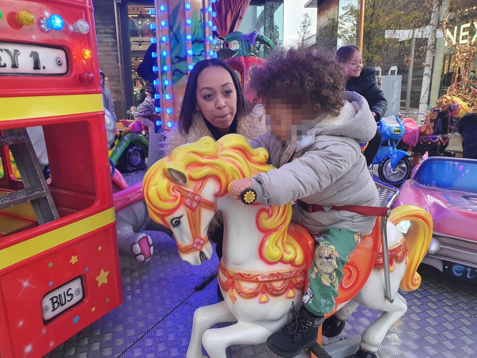 Zara with her son Callum, whose teachers know about her job