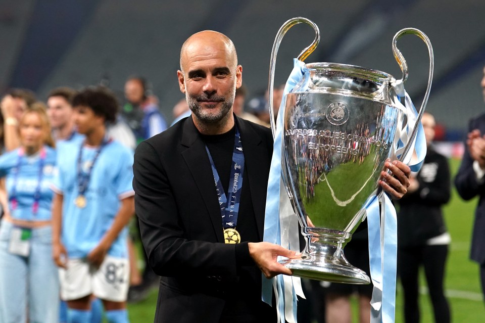 a man holding a trophy that says champions league europe